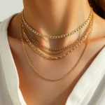 Luxury gold and silver mixed metal necklace stack on model with neutral linen clothing, natural lighting, minimalist aesthetic, photorealistic fashion styling