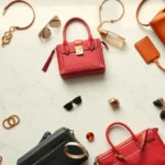 Overhead view of luxury designer handbags and accessories arranged on marble surface, soft natural lighting, high-end fashion photography style, colorful designer pieces from various brands, sophisticated styling
