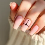 Elegant minimalist nail design featuring soft pink base with single black geometric line, professional manicure, natural lighting, close-up hand shot, modern sophistication, high fashion aesthetic