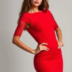 Woman wearing vibrant red bodycon midi dress, confident posture, neutral background, professional studio lighting, fashion photography style