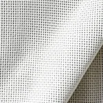 Close-up of premium sustainable organic cotton fabric texture with visible weave pattern, natural lighting emphasizing material quality and craftsmanship details